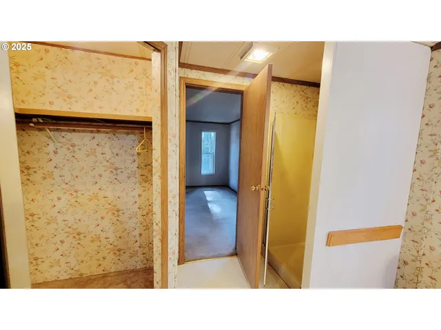 a bathroom with a tub and shower