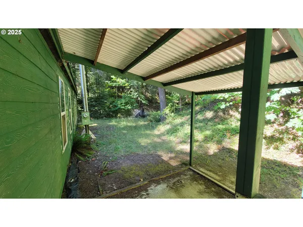 a black and white photo of a green field