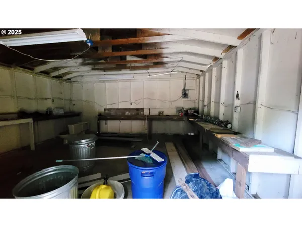 a kitchen with a sink and wooden floor
