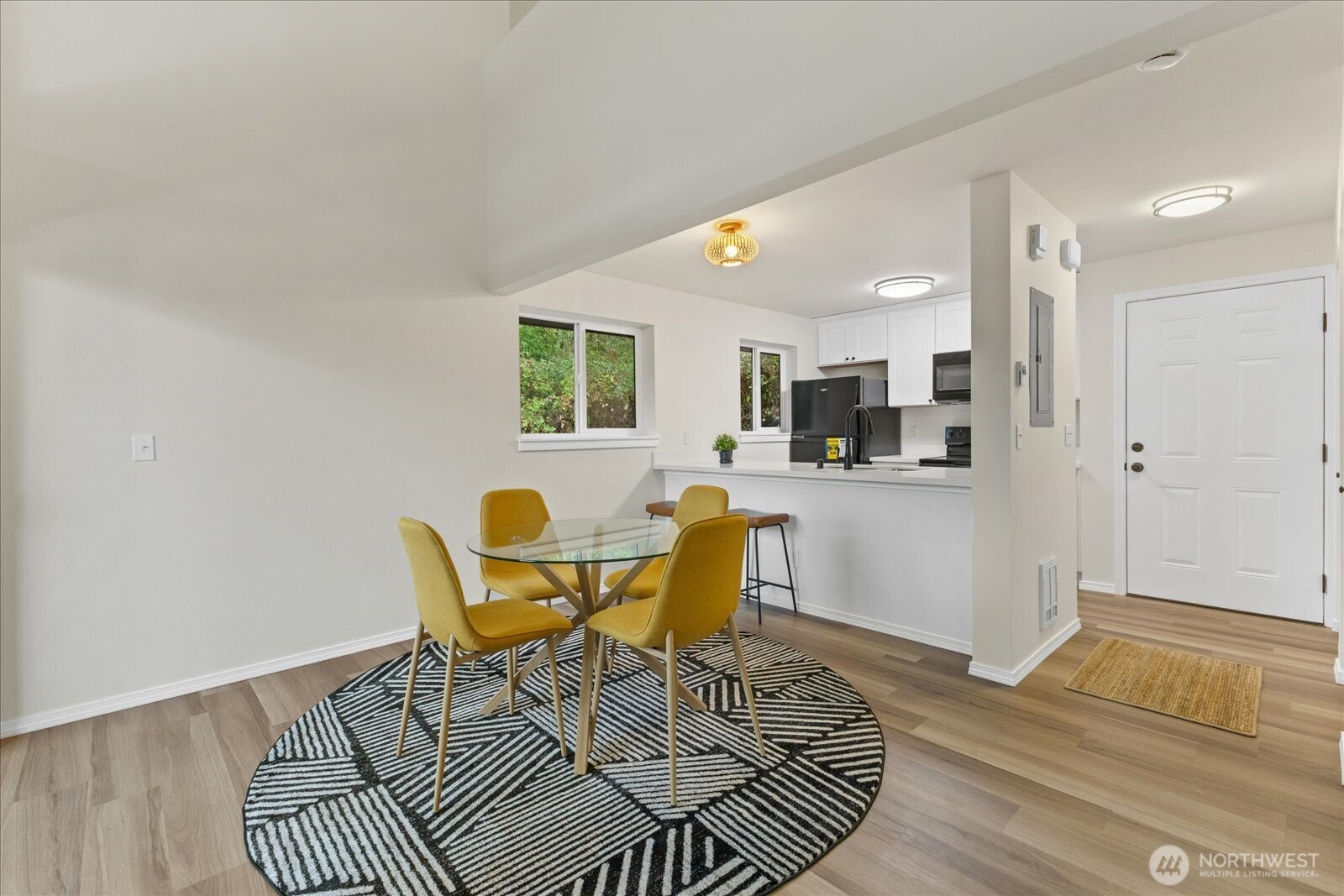 12600 57th Avenue South, Unit B201 Seattle, WA 98178 - Photo 12 of 24 a view of a dining room with furniture and wooden floor