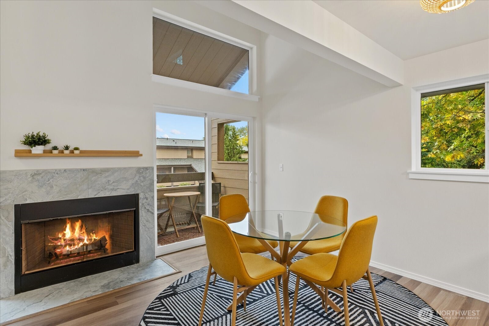 12600 57th Avenue South, Unit B201 Seattle, WA 98178 - Photo 14 of 24 a living room with chairs and a fireplace
