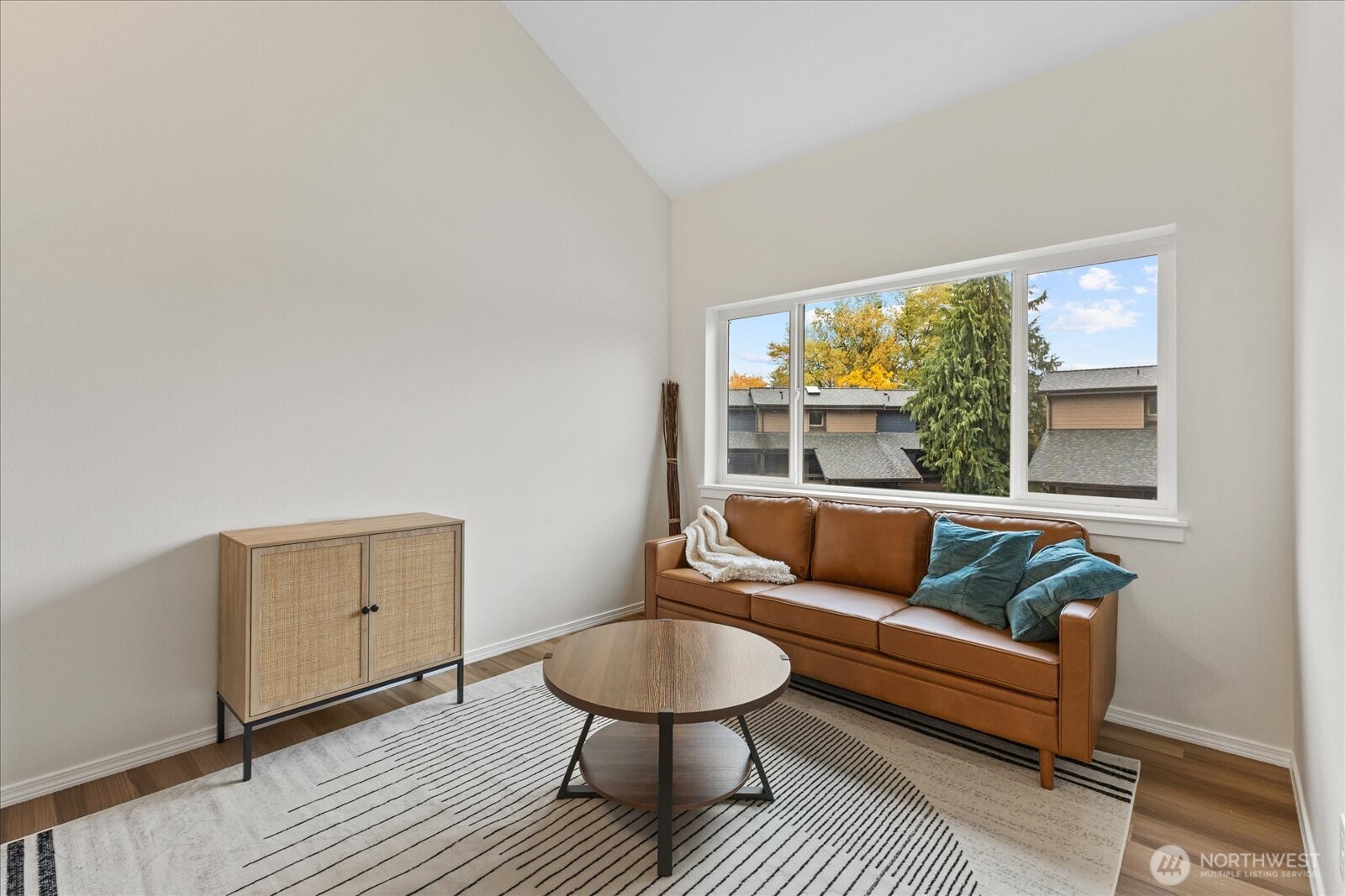12600 57th Avenue South, Unit B201 Seattle, WA 98178 - Photo 16 of 24 a living room with furniture and a window