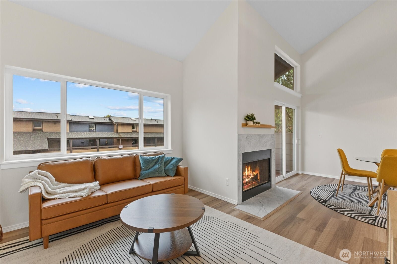 12600 57th Avenue South, Unit B201 Seattle, WA 98178 - Photo 17 of 24 a living room with furniture and a fireplace