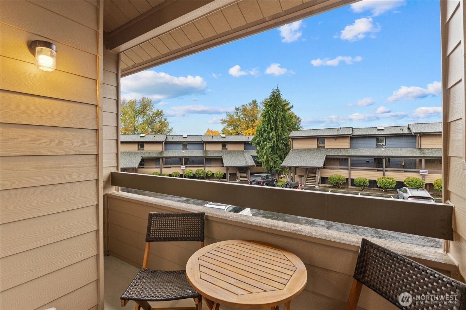 12600 57th Avenue South, Unit B201 Seattle, WA 98178 - Photo 18 of 24 a view of a chairs and table in the balcony