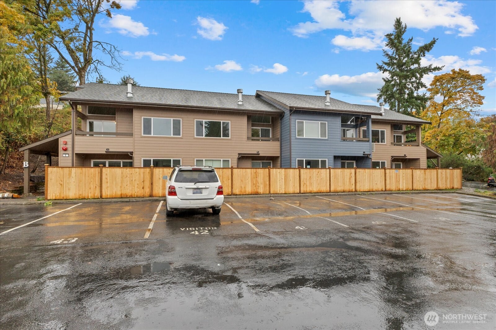 12600 57th Avenue South, Unit B201 Seattle, WA 98178 - Photo 2 of 24 a front view of a house with a garden