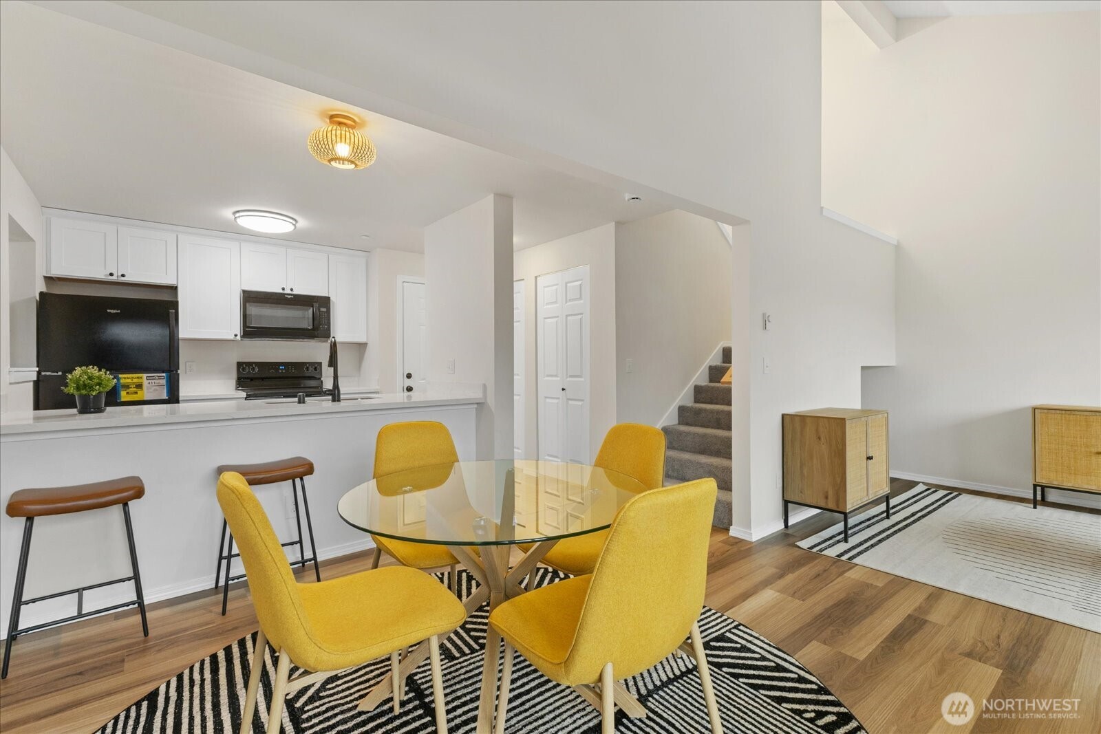 12600 57th Avenue South, Unit B201 Seattle, WA 98178 - Photo 10 of 24 a living room with dining room and wooden floor