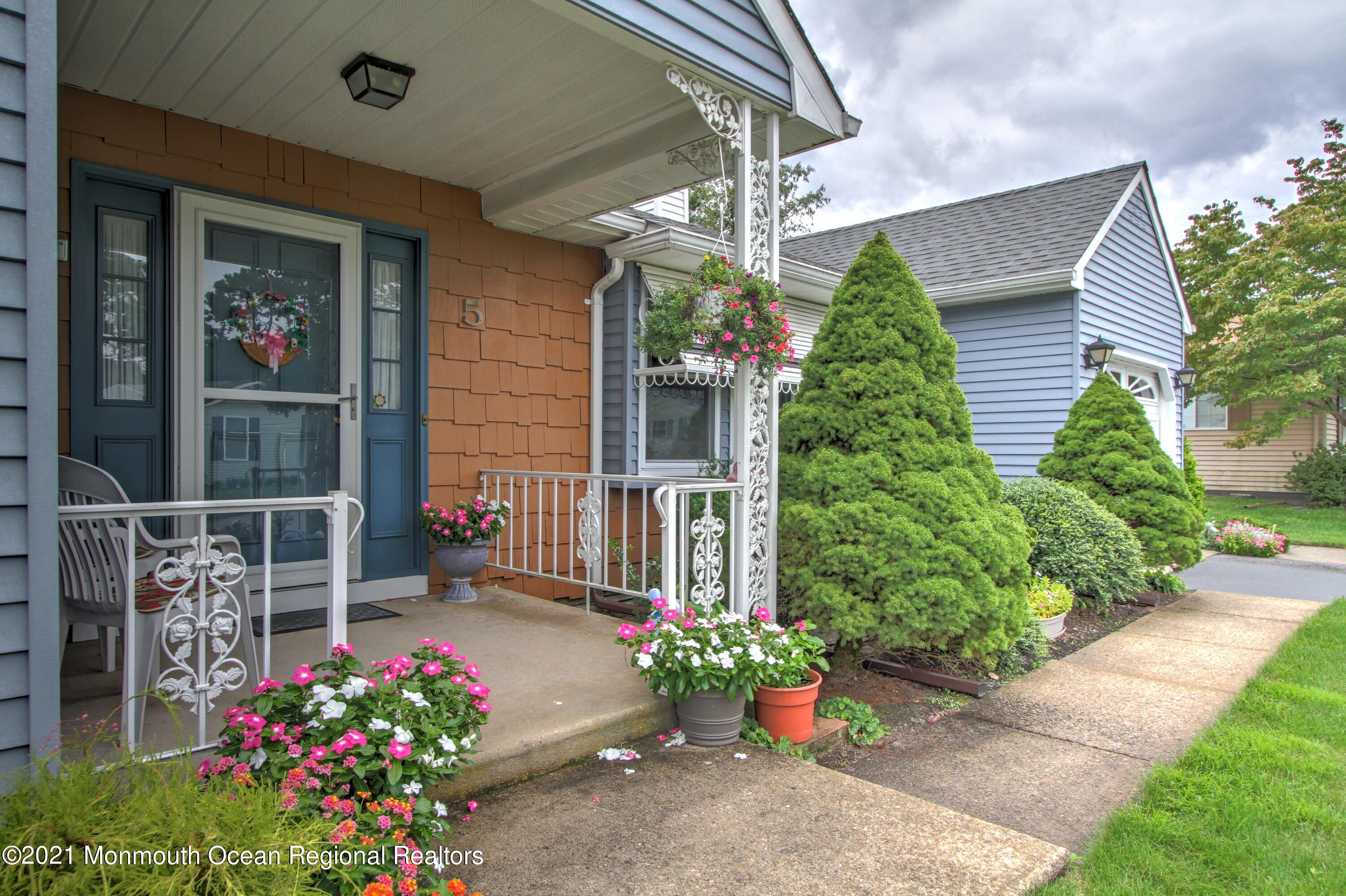 5 Amherst Road Whiting, NJ 08759 - Photo 22 of 29 a flower garden and a wooden bench