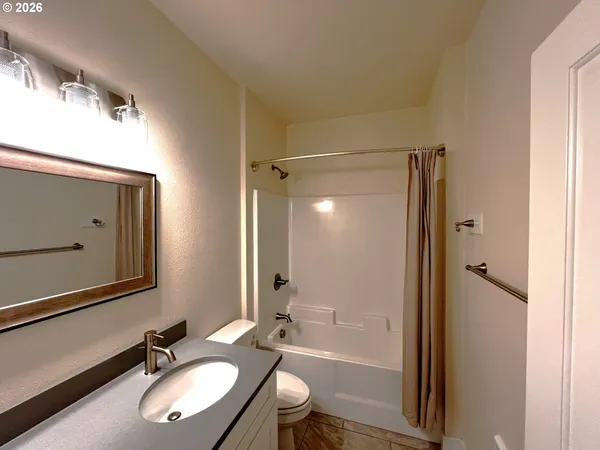 a view of storage and utility room with racks on the wall