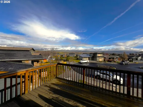 a view of balcony with wooden floor
