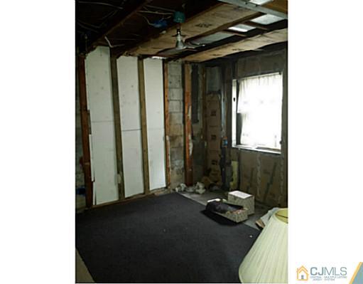 57 Driftway Road Howell, NJ 07731 - Photo 12 of 13 a room with furniture and a window