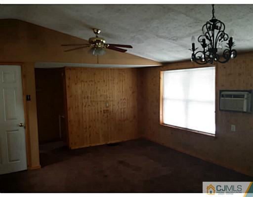 57 Driftway Road Howell, NJ 07731 - Photo 5 of 13 a room with a window and a chandelier