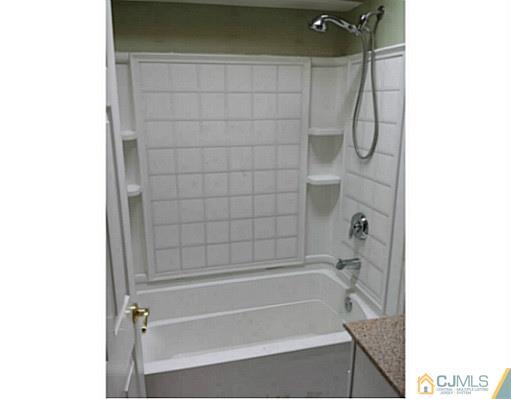 57 Driftway Road Howell, NJ 07731 - Photo 8 of 13 a bathroom with a bathtub