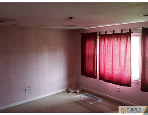 57 Driftway Road Howell, NJ 07731 - Photo 9 of 13 a view of a room with red walls and a window