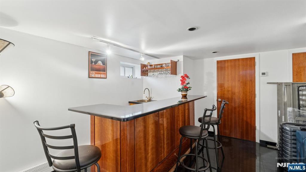 233 Lasalle Avenue Hasbrouck Heights, NJ 07604 - Photo 14 of 27 a view of a dining room with furniture and wooden floor