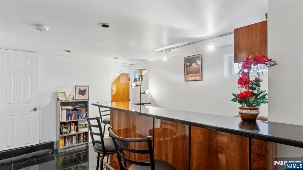 233 Lasalle Avenue Hasbrouck Heights, NJ 07604 - Photo 16 of 27 a view of a dining room with furniture and wooden floor