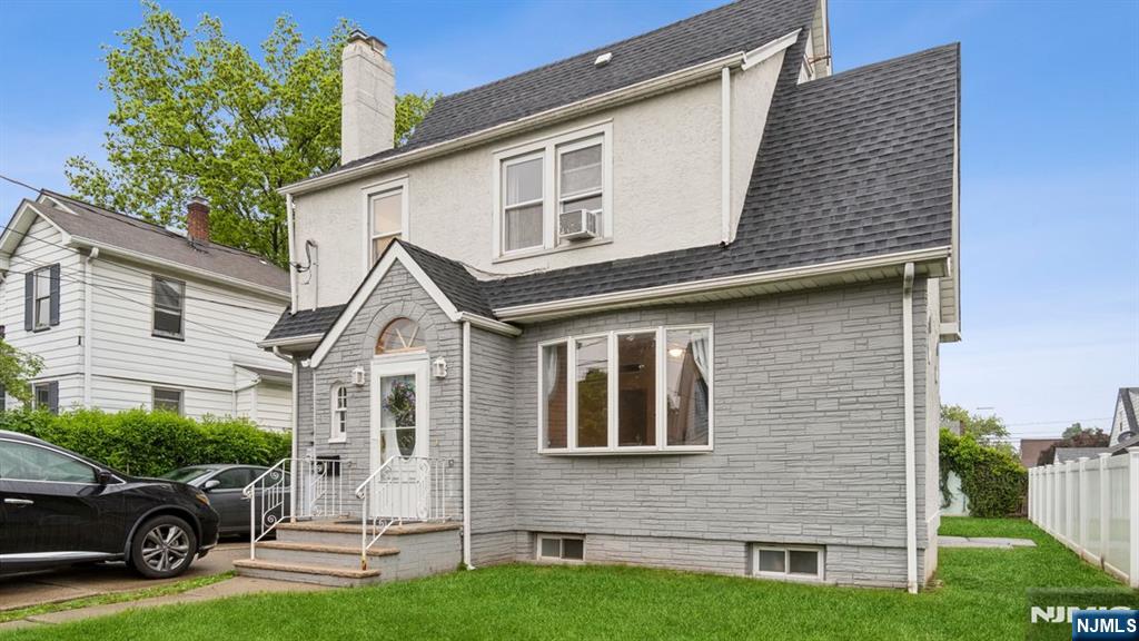 233 Lasalle Avenue Hasbrouck Heights, NJ 07604 - Photo 2 of 27 a front view of a house with garden