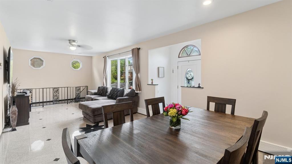 233 Lasalle Avenue Hasbrouck Heights, NJ 07604 - Photo 7 of 27 a view of a dining room with furniture and wooden floor