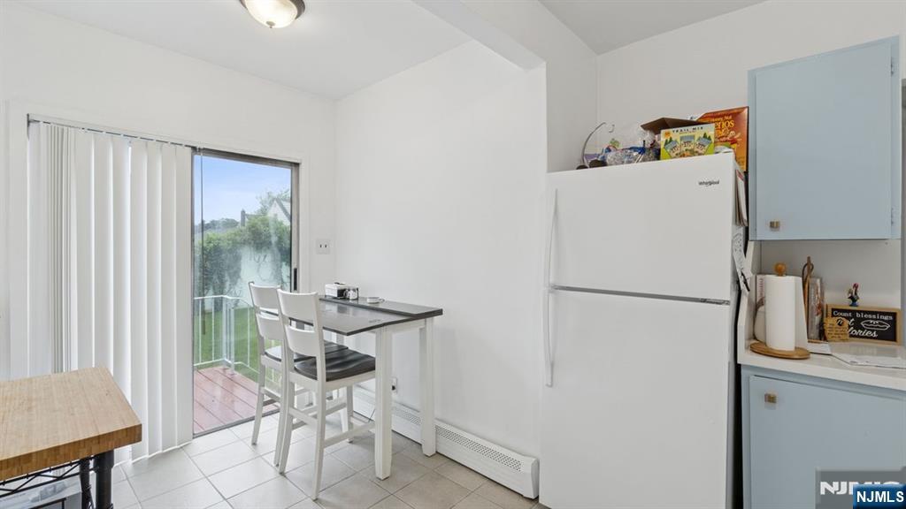 233 Lasalle Avenue Hasbrouck Heights, NJ 07604 - Photo 10 of 27 a white refrigerator freezer sitting in a kitchen