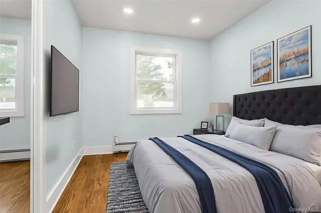 a bedroom with bed and a window