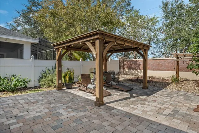 a view of a chair and table in the patio
