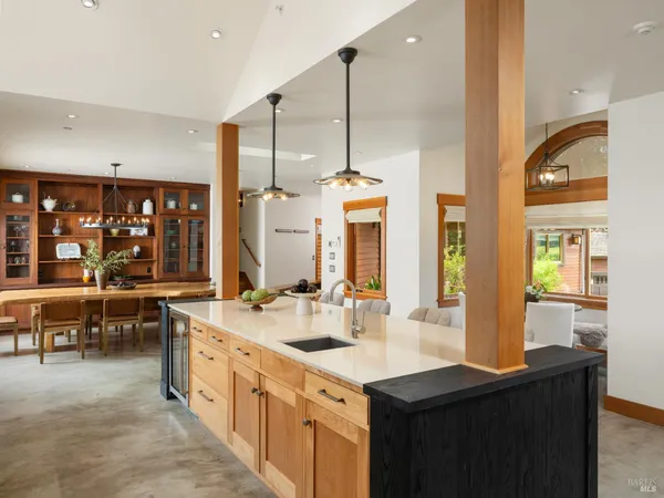 a kitchen with stainless steel appliances a sink stove and cabinets