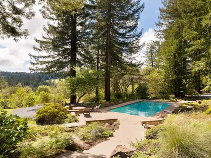 a view of swimming pool with a patio
