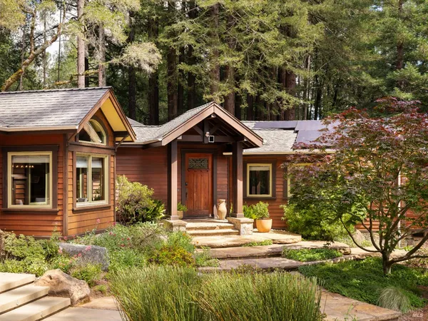 a view of a house with garden and plants