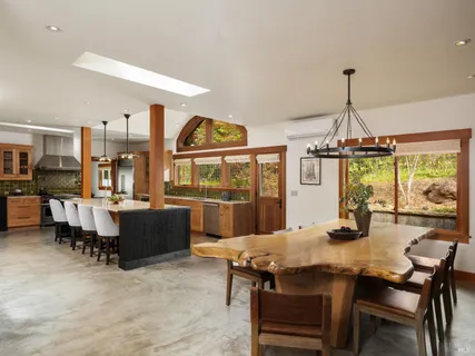a view of a dining room with furniture window and outside view