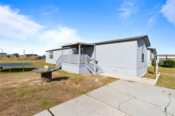 a view of a swimming pool with a lounge chairs