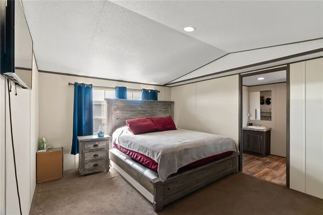 a bedroom with a bed and a couch