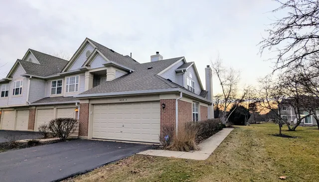 a view of a house with a snow in the yard