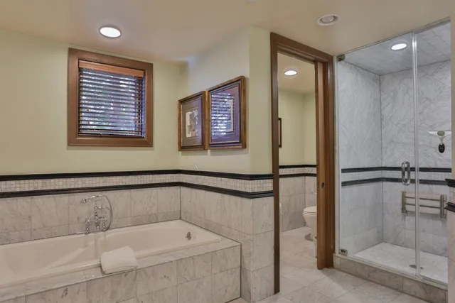 a bathroom with a tub and a shower