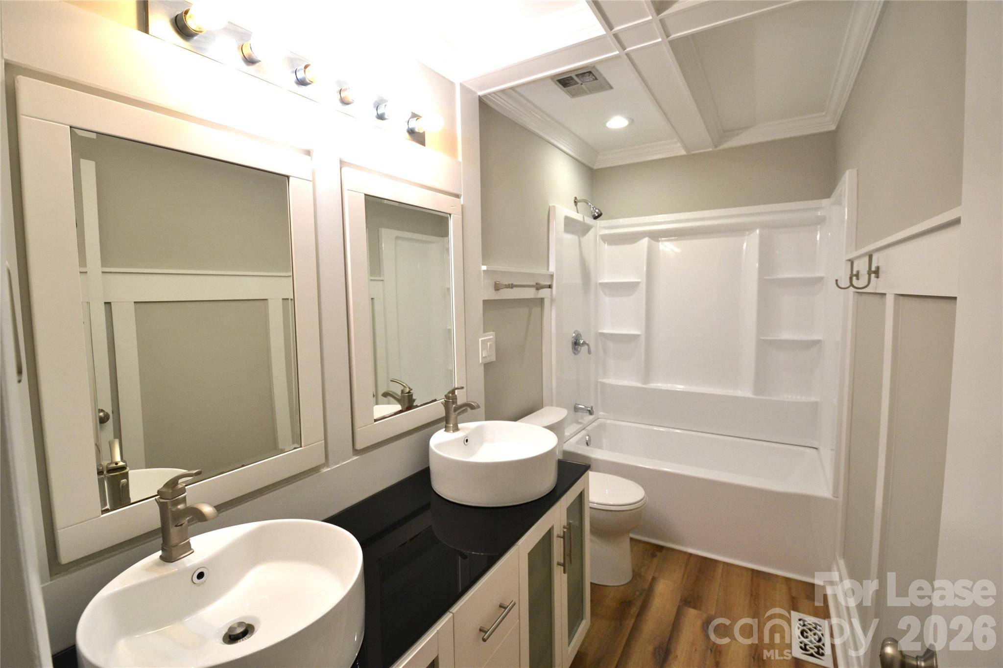 1422 Thermal Road Charlotte, NC 28212 - Photo 18 of 40 a bathroom with a sink and a mirror