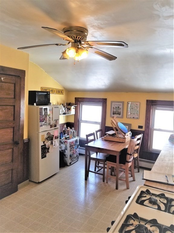 12 Linden Circle Somerville, MA 02143 - Photo 13 of 24 a view of a dining room with furniture and a chandelier