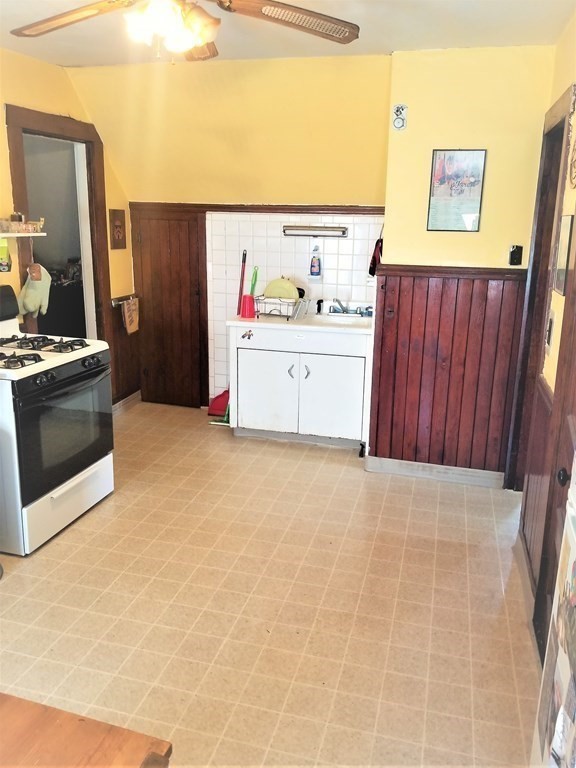 12 Linden Circle Somerville, MA 02143 - Photo 14 of 24 a view of kitchen with cabinets and window