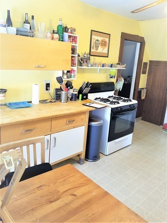 12 Linden Circle Somerville, MA 02143 - Photo 15 of 24 a kitchen with stainless steel appliances granite countertop a stove and a refrigerator