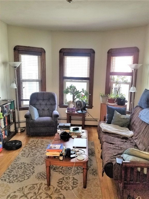 12 Linden Circle Somerville, MA 02143 - Photo 4 of 24 a living room with furniture wooden floor and a large window