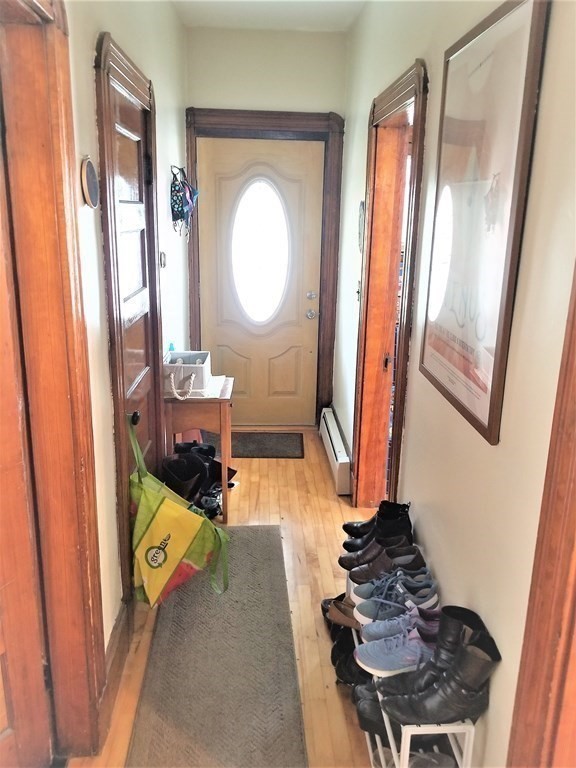 12 Linden Circle Somerville, MA 02143 - Photo 5 of 24 a room with wooden floor and furniture