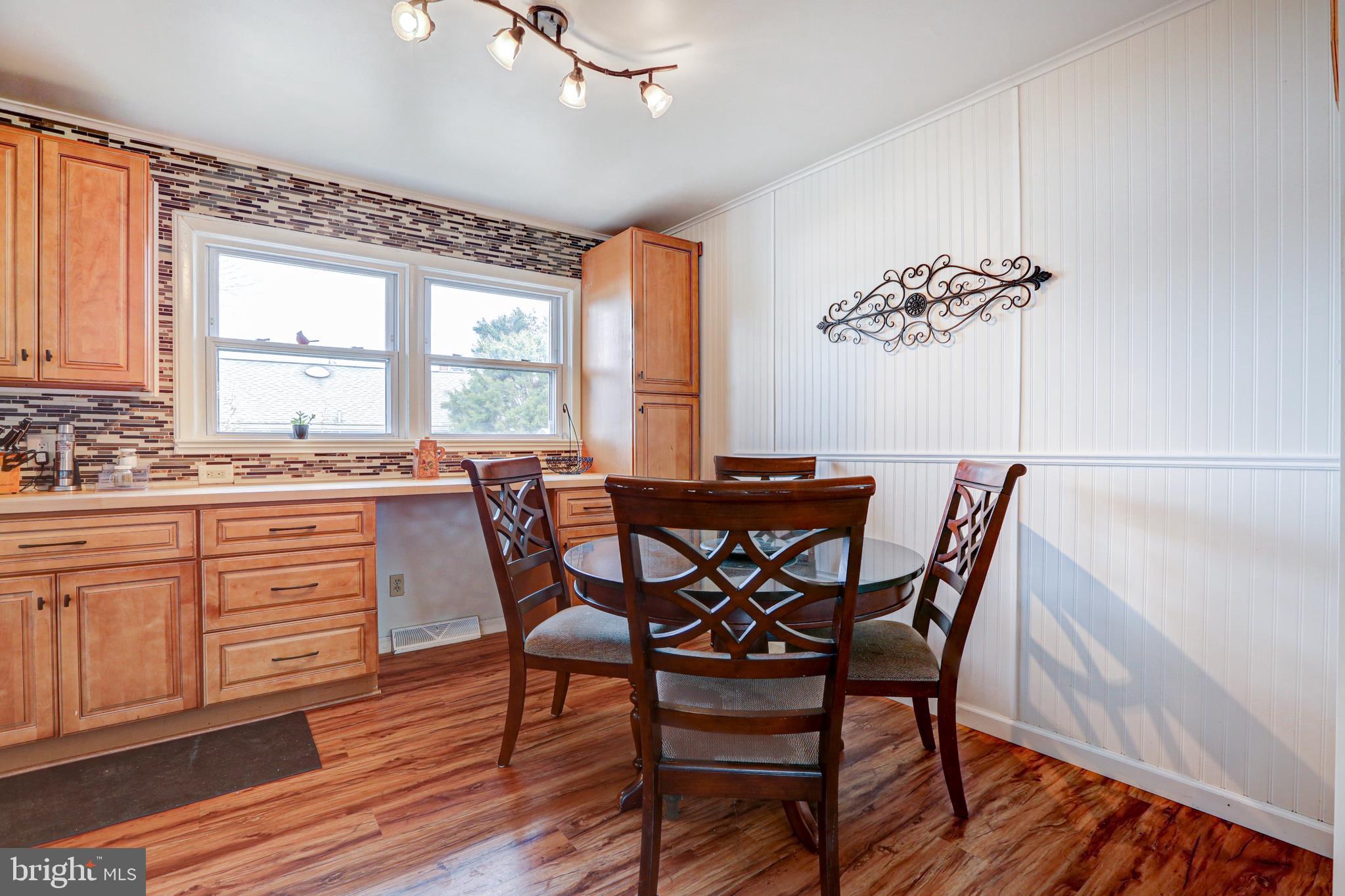 12 Jefferson Road Pennsville, NJ 08070 - Photo 12 of 63 a view of a dining room with furniture window and wooden floor