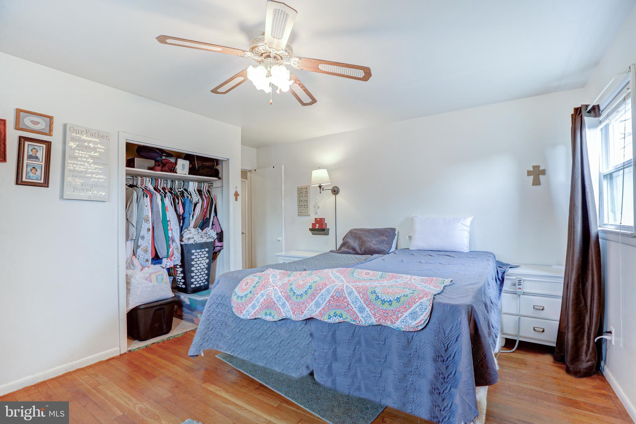 12 Jefferson Road Pennsville, NJ 08070 - Photo 22 of 63 a bedroom with a bed and a chandelier