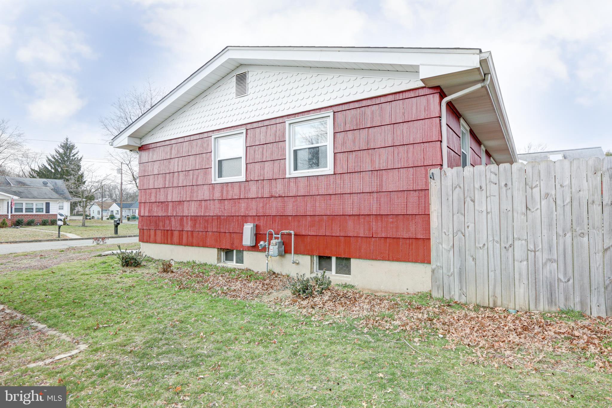12 Jefferson Road Pennsville, NJ 08070 - Photo 47 of 63 a front view of a house with a yard