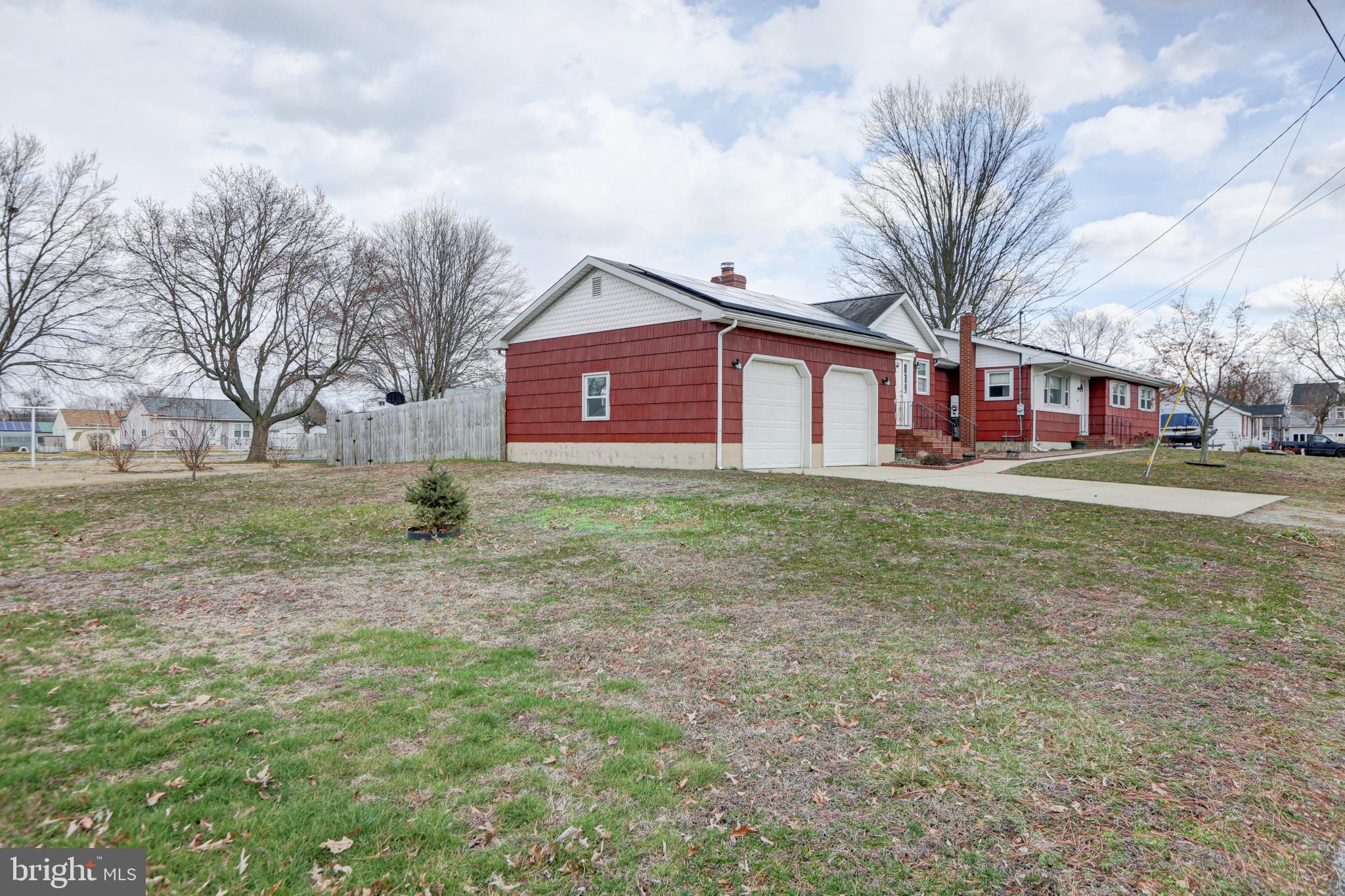 12 Jefferson Road Pennsville, NJ 08070 - Photo 53 of 63 a front view of house with yard and trees
