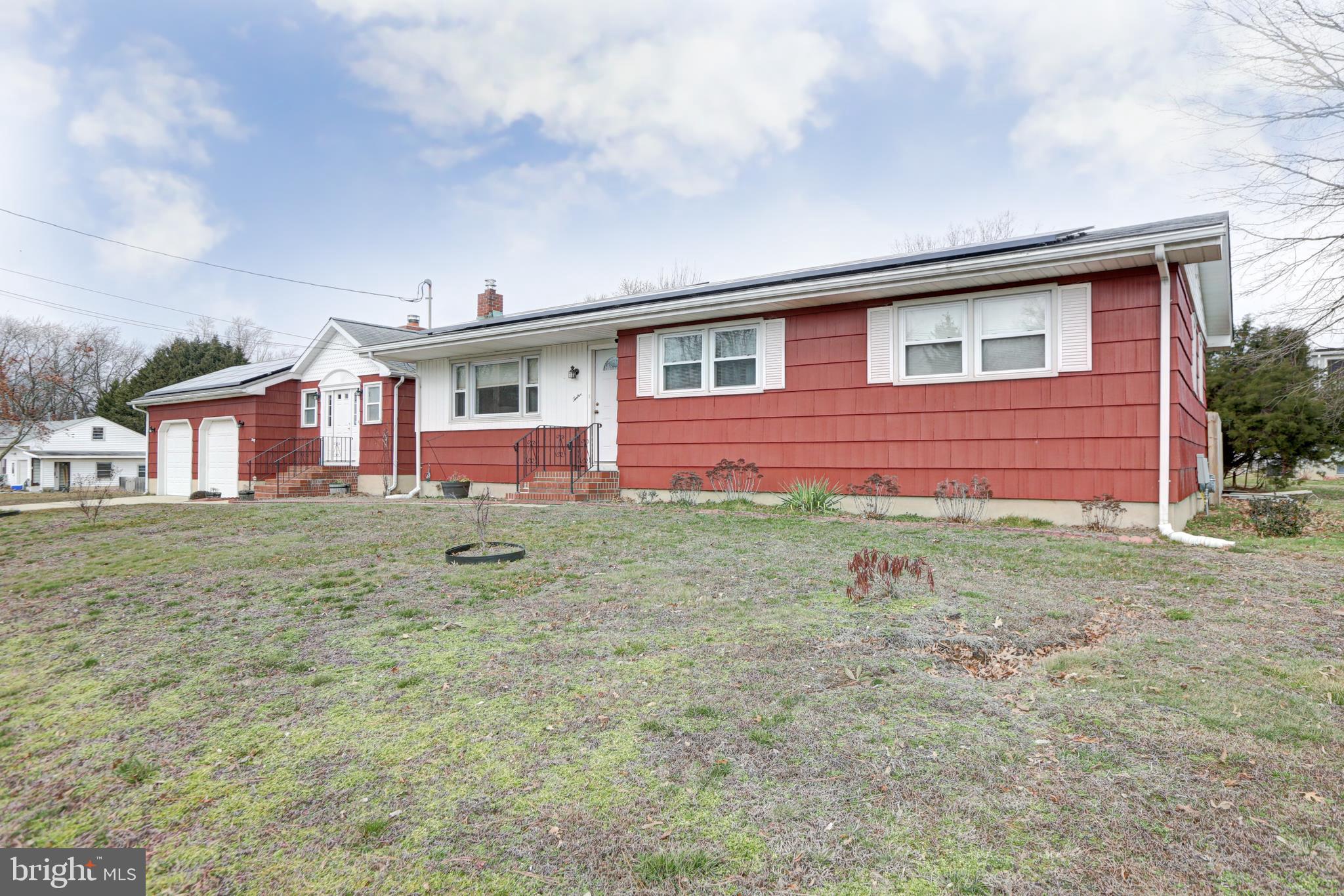 12 Jefferson Road Pennsville, NJ 08070 - Photo 55 of 63 a front view of a house with garden