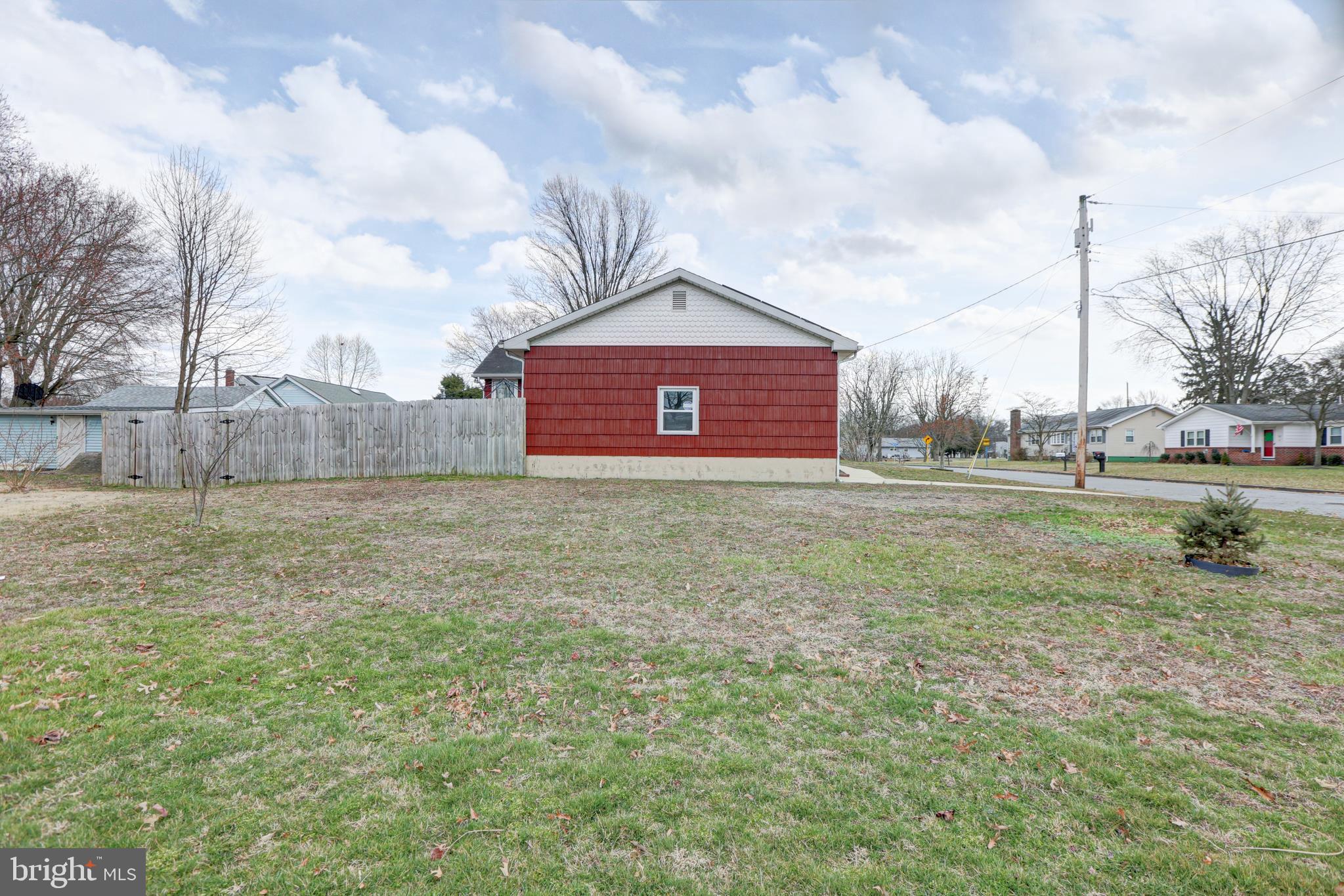 12 Jefferson Road Pennsville, NJ 08070 - Photo 56 of 63 a view of a big house with a big yard and large trees