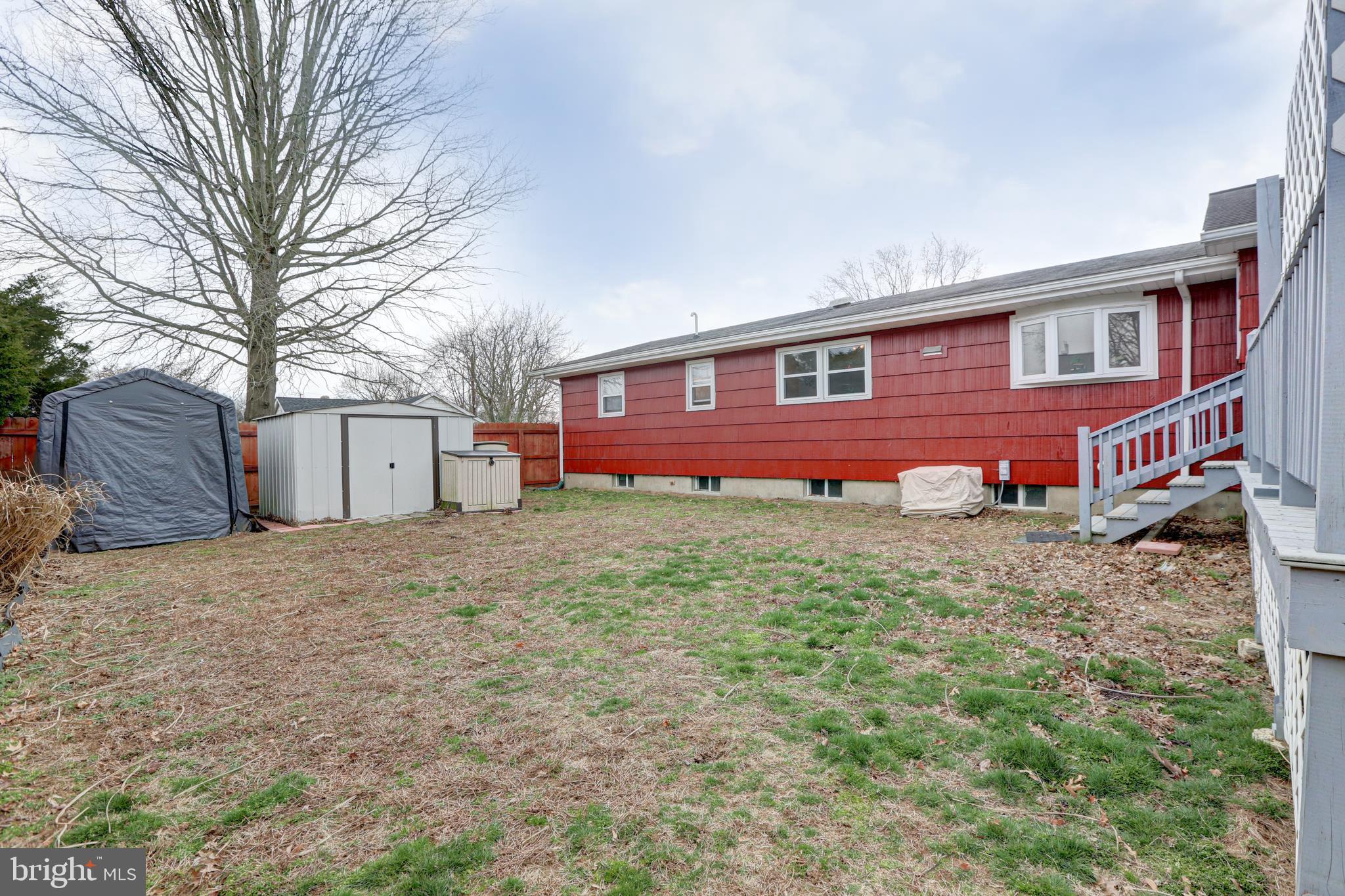 12 Jefferson Road Pennsville, NJ 08070 - Photo 58 of 63 a front view of a house with a yard