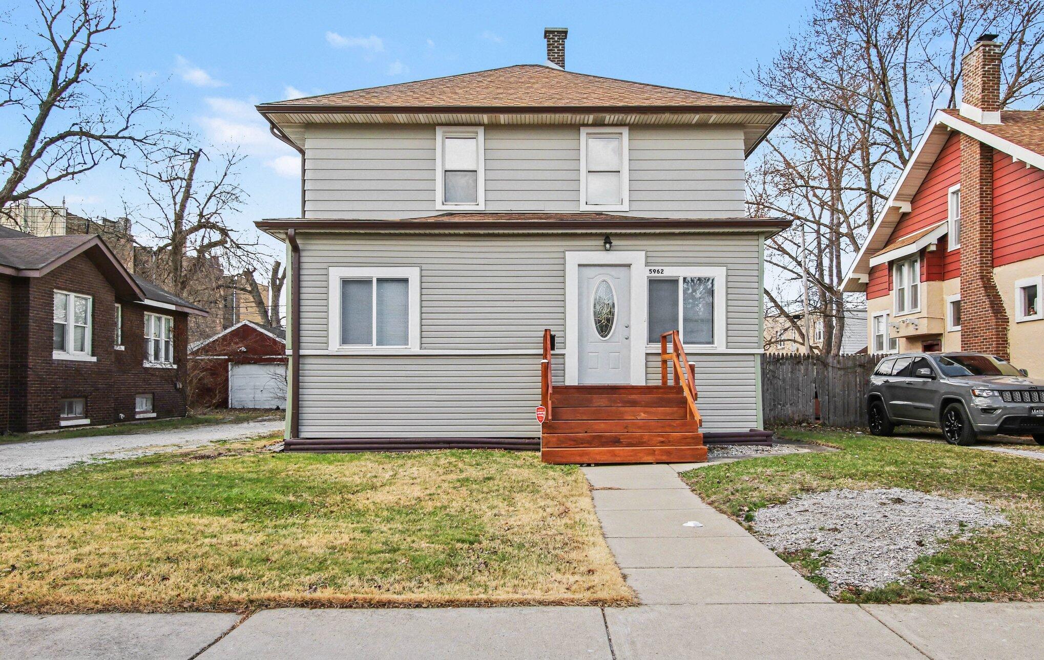 5962 Park Place Hammond, IN 46320 - Photo 1 of 20 a front view of a house with a yard