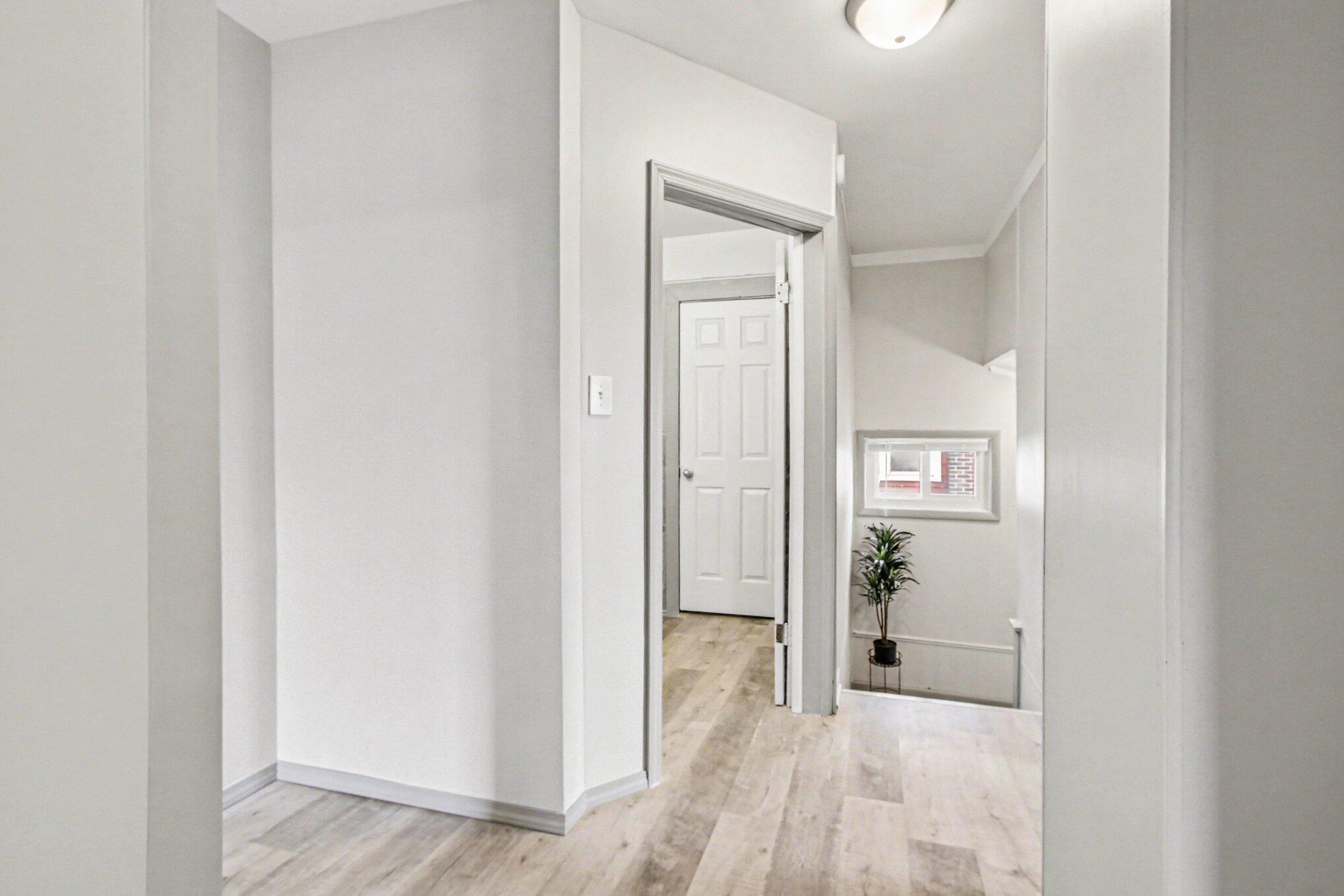 5962 Park Place Hammond, IN 46320 - Photo 17 of 20 a view of a hallway with wooden floor