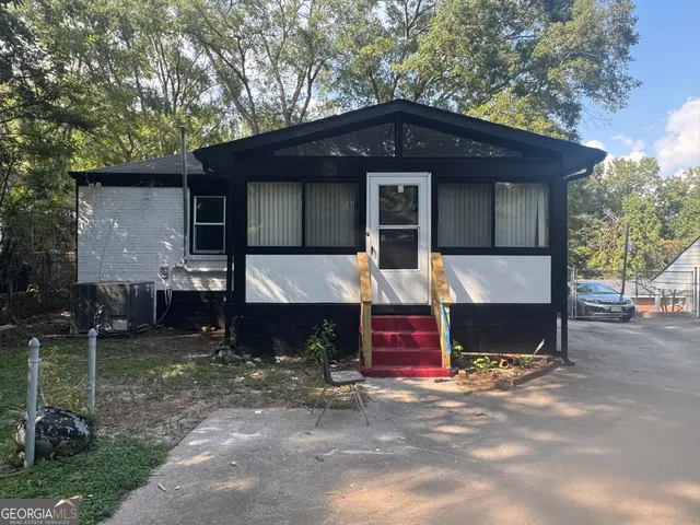 a front view of a house with yard