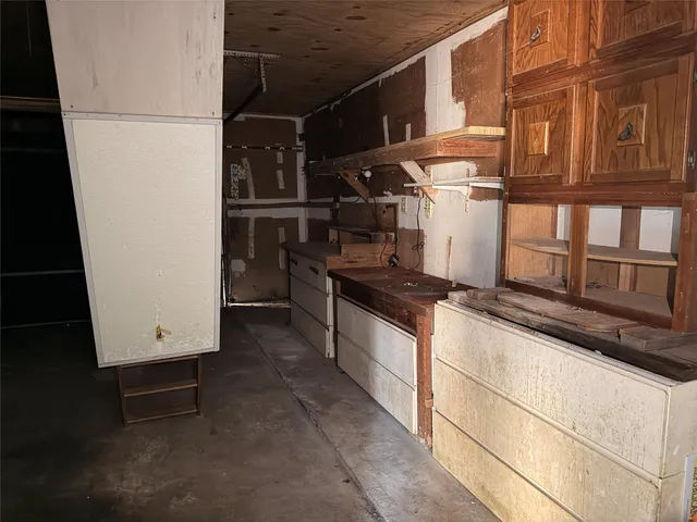 a kitchen with stainless steel appliances granite countertop a refrigerator and a stove