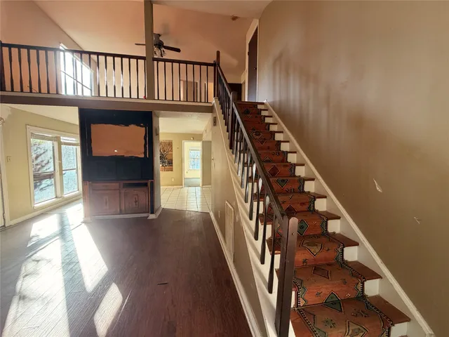 a view of an entryway with wooden floor